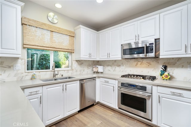 1782 Saige View Cir, Upland, CA 91784 - kitchen with stainless steel appliances, white cabinetry, recessed lighting, light countertops, and backsplash