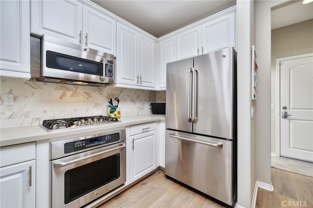 1782 Saige View Cir, Upland, CA 91784 - kitchen with appliances with stainless steel finishes, light wood-type flooring, and white cabinets
