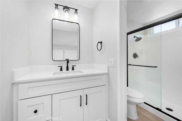 18684 Santa Ynez St, Fountain Valley, CA 92708 - bathroom featuring a stall shower, vanity, and wood finished floors