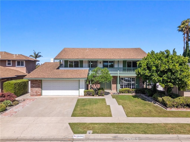 18684 Santa Ynez St, Fountain Valley, CA 92708 - view of front facade featuring a balcony, driveway, a front yard, brick siding, and an attached garage