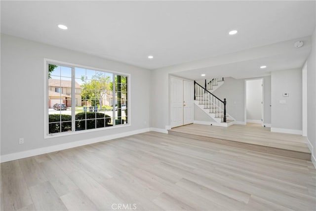 18684 Santa Ynez St, Fountain Valley, CA 92708 - unfurnished living room featuring light wood finished floors, stairs, and recessed lighting