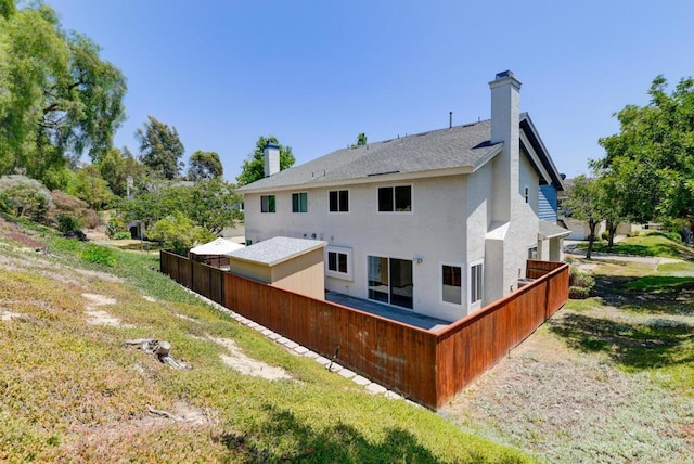 1403 Manzana Way, San Diego, CA 92139 - back of property with stucco siding, a shingled roof, and a chimney