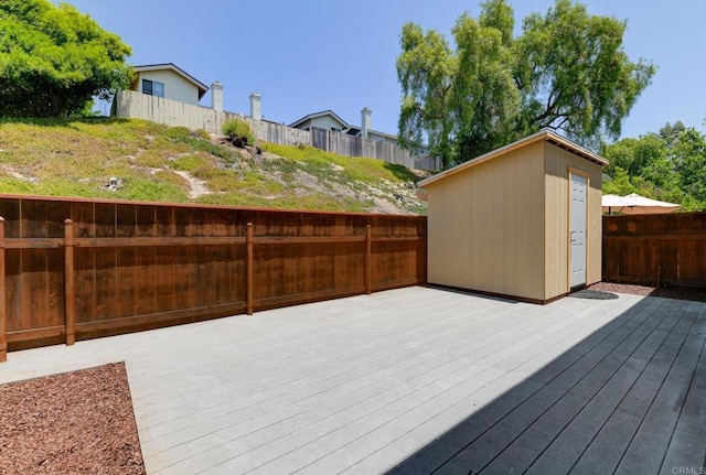 1403 Manzana Way, San Diego, CA 92139 - wooden deck with a fenced backyard and a storage shed