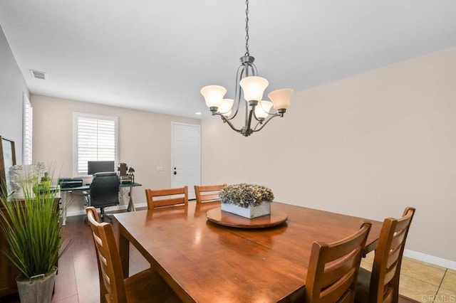 1702 Brezar St, Chula Vista, CA 91913 - dining area featuring a chandelier and baseboards