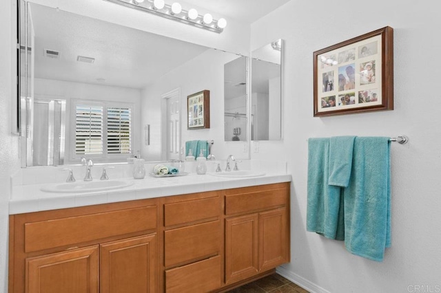 1702 Brezar St, Chula Vista, CA 91913 - full bath with double vanity, a shower with door, and tile patterned flooring