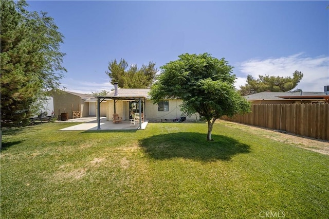 41015 163rd St E, Lancaster, CA 93535 - rear view of house featuring a patio area, a fenced backyard, and stucco siding
