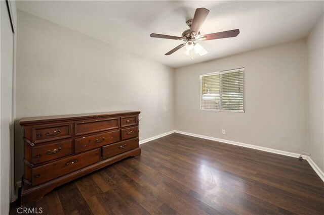 41015 163rd St E, Lancaster, CA 93535 - unfurnished bedroom featuring dark wood-type flooring and a ceiling fan