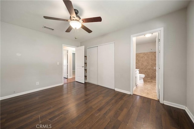 41015 163rd St E, Lancaster, CA 93535 - unfurnished bedroom featuring dark wood-style floors, a closet, ensuite bathroom, and a ceiling fan