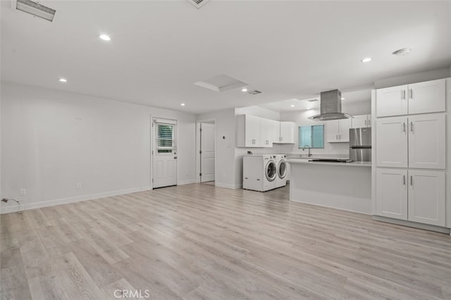 12424 Sarah St, Studio City, CA 91604 - unfurnished living room with separate washer and dryer, light wood finished floors, and recessed lighting
