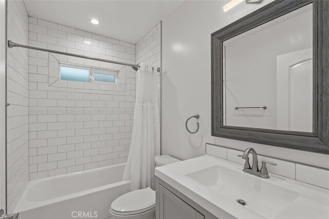 12424 Sarah St, Studio City, CA 91604 - bathroom featuring vanity, shower / bath combo with shower curtain, and recessed lighting