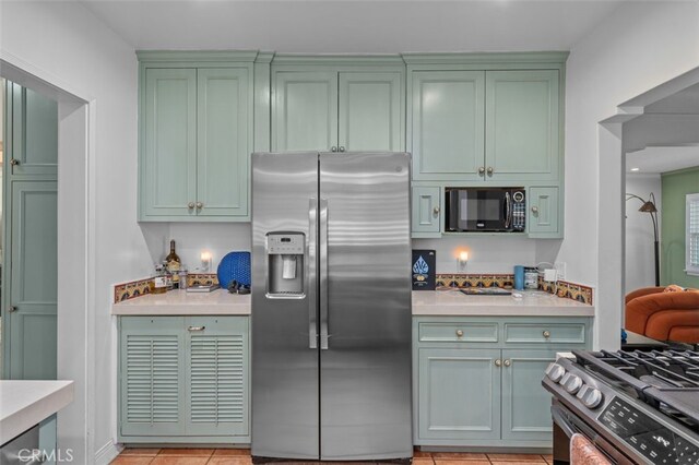 12424 Sarah St, Studio City, CA 91604 - kitchen with stainless steel appliances, green cabinets, and light countertops