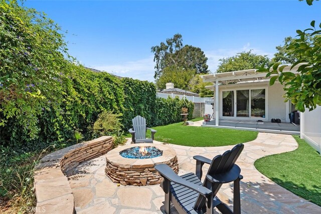 12424 Sarah St, Studio City, CA 91604 - view of patio with a fire pit and a pergola