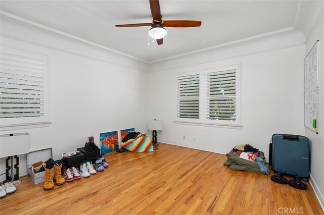 12424 Sarah St, Studio City, CA 91604 - bedroom featuring wood finished floors, multiple windows, and a ceiling fan
