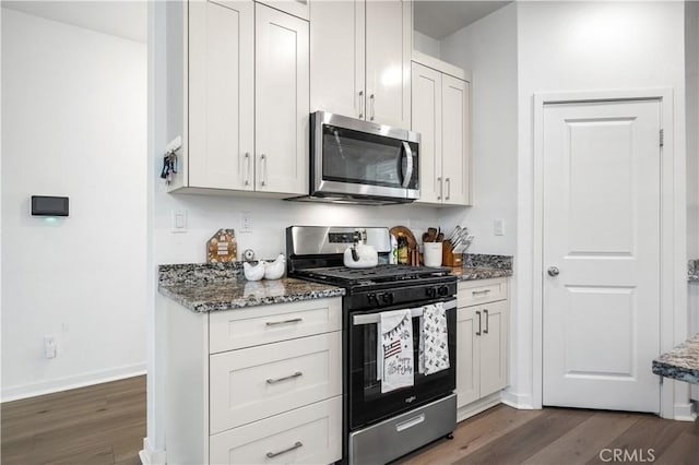 12366 Ranchito Way, Victorville, CA 92392 - kitchen with stainless steel appliances, stone counters, and dark wood-style floors
