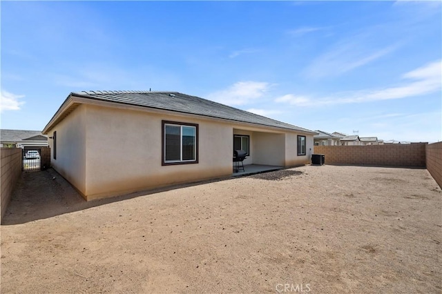 12366 Ranchito Way, Victorville, CA 92392 - back of property featuring a patio area, a fenced backyard, and stucco siding