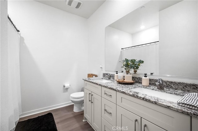 12366 Ranchito Way, Victorville, CA 92392 - bathroom with wood finished floors, double vanity, and a shower with shower curtain