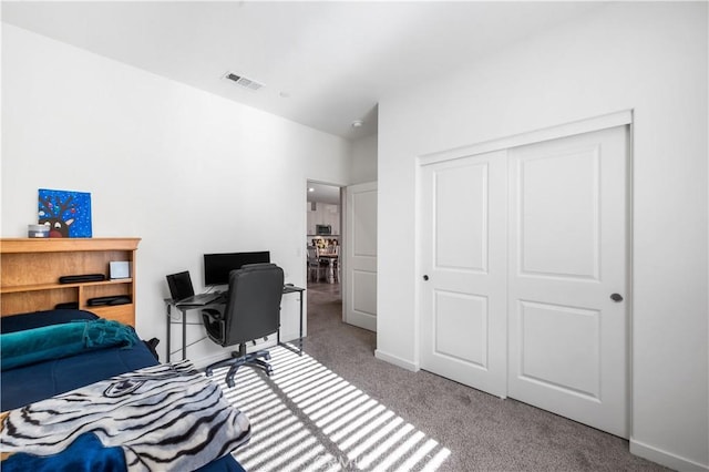 12366 Ranchito Way, Victorville, CA 92392 - bedroom with carpet, a closet, and an office area