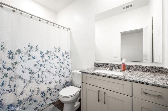 12366 Ranchito Way, Victorville, CA 92392 - bathroom with vanity, a shower with shower curtain, and wood finished floors