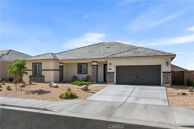 12366 Ranchito Way, Victorville, CA 92392 - ranch-style house with a garage, stucco siding, driveway, stone siding, and a tile roof