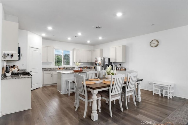 12366 Ranchito Way, Victorville, CA 92392 - dining area featuring dark wood finished floors and recessed lighting