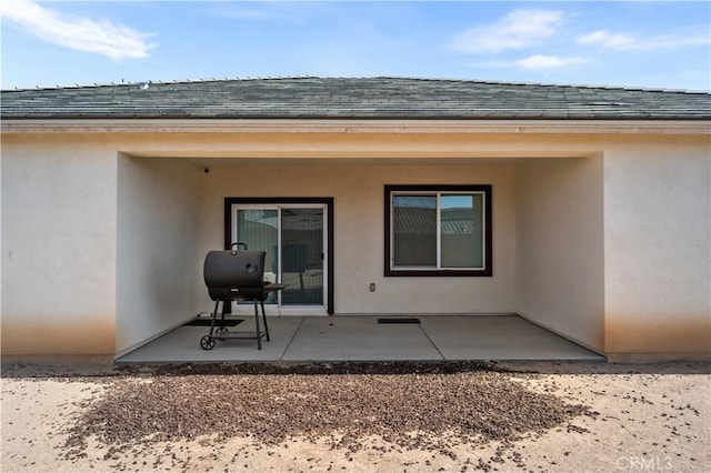 12366 Ranchito Way, Victorville, CA 92392 - rear view of house featuring a patio, stucco siding, and a shingled roof