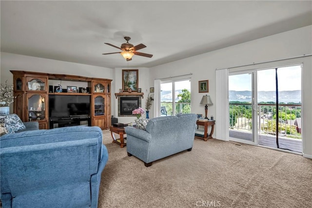 4445 Eucalyptus Ave, Lakeport, CA 95453 - living room featuring a ceiling fan and light carpet