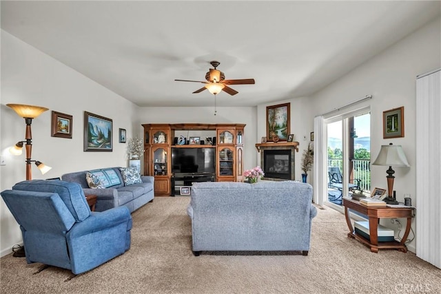 4445 Eucalyptus Ave, Lakeport, CA 95453 - living area with light carpet, a ceiling fan, and a glass covered fireplace