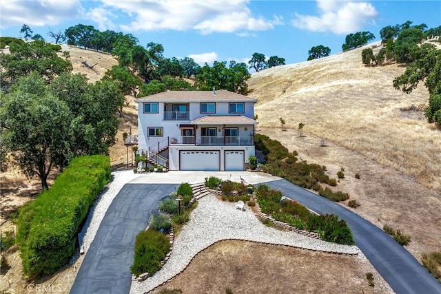 4445 Eucalyptus Ave, Lakeport, CA 95453 - view of front of property with an attached garage, driveway, stairway, and a balcony