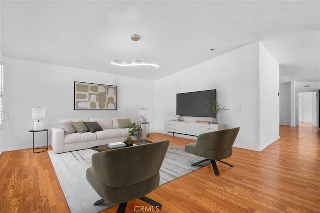 1225 N Alessandro St, Banning, CA 92220 - living area featuring wood finished floors and a chandelier