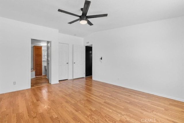 1225 N Alessandro St, Banning, CA 92220 - unfurnished bedroom with light wood finished floors, ensuite bathroom, and a ceiling fan