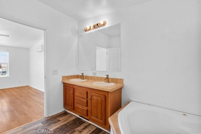 1225 N Alessandro St, Banning, CA 92220 - full bathroom with wood finished floors, double vanity, and a bath