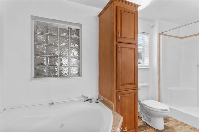 1225 N Alessandro St, Banning, CA 92220 - full bathroom featuring a tub with jets, a shower, and wood finished floors