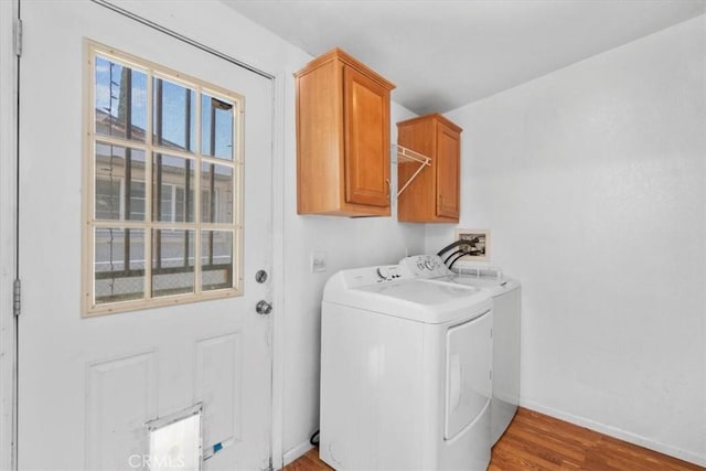 1225 N Alessandro St, Banning, CA 92220 - washroom featuring washer and clothes dryer, wood finished floors, and cabinet space