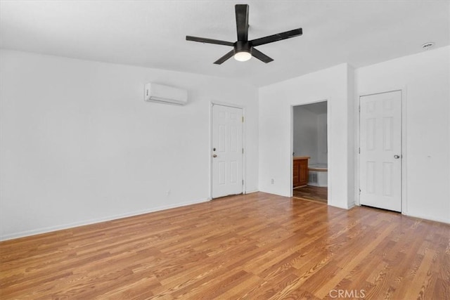 1225 N Alessandro St, Banning, CA 92220 - unfurnished room featuring light wood-style flooring, a wall unit AC, and a ceiling fan