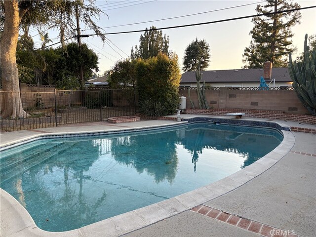 6621 Berquist Ave, West Hills, CA 91307 - pool at dusk featuring a fenced backyard