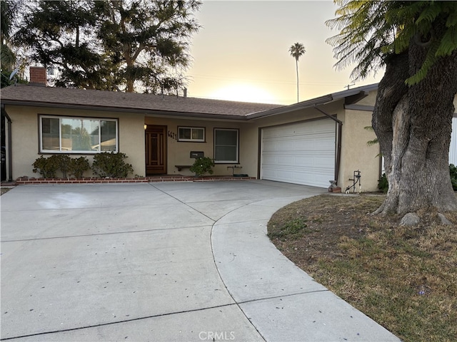 6621 Berquist Ave, West Hills, CA 91307 - ranch-style house featuring stucco siding, concrete driveway, a garage, and a chimney