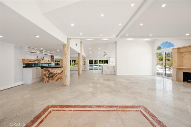3856 Vista Linda Dr, Encino, CA 91316 - unfurnished living room with a premium fireplace, recessed lighting, and light marble finish flooring