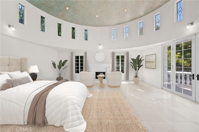 3856 Vista Linda Dr, Encino, CA 91316 - bedroom featuring a high ceiling, access to outside, a fireplace, multiple windows, and light tile patterned floors
