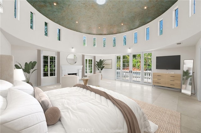 3856 Vista Linda Dr, Encino, CA 91316 - bedroom with tile patterned floors, access to exterior, a fireplace, a towering ceiling, and recessed lighting