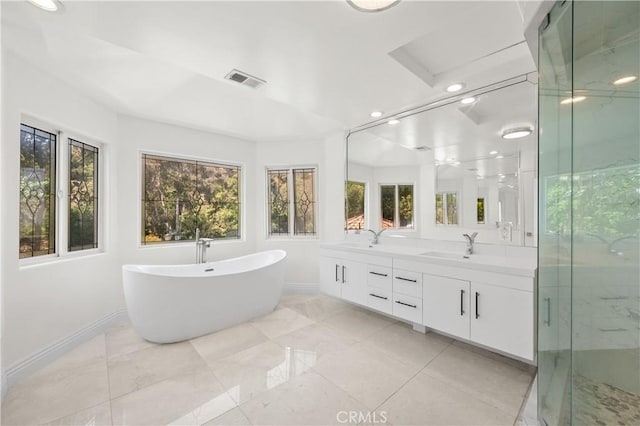 3856 Vista Linda Dr, Encino, CA 91316 - full bathroom with healthy amount of natural light, double vanity, a freestanding tub, a marble finish shower, and recessed lighting