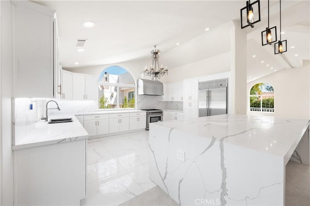 3856 Vista Linda Dr, Encino, CA 91316 - kitchen with premium appliances, a chandelier, backsplash, lofted ceiling, and recessed lighting