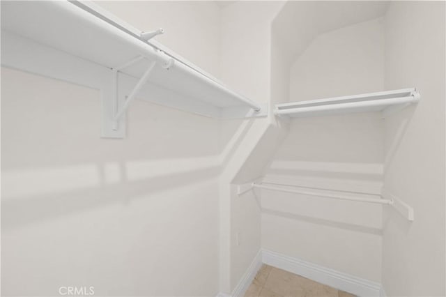 3856 Vista Linda Dr, Encino, CA 91316 - spacious closet featuring light tile patterned floors