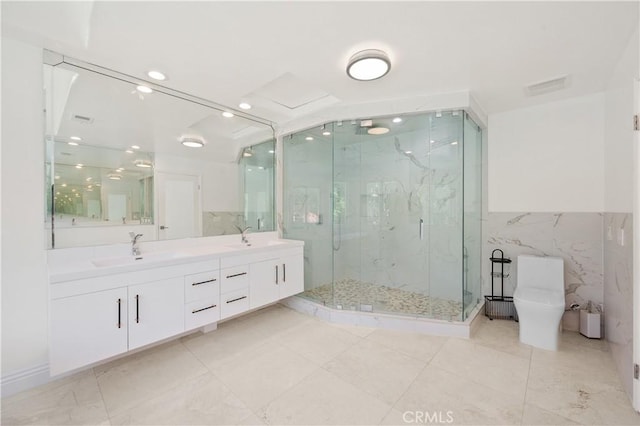3856 Vista Linda Dr, Encino, CA 91316 - bathroom featuring a marble finish shower, double vanity, and tile walls