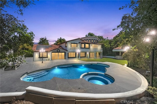 3856 Vista Linda Dr, Encino, CA 91316 - pool at dusk featuring a patio and a pool with connected hot tub