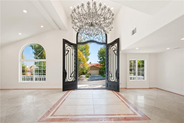 3856 Vista Linda Dr, Encino, CA 91316 - entryway with a high ceiling, recessed lighting, a chandelier, inlaid floor details, and marble finish flooring