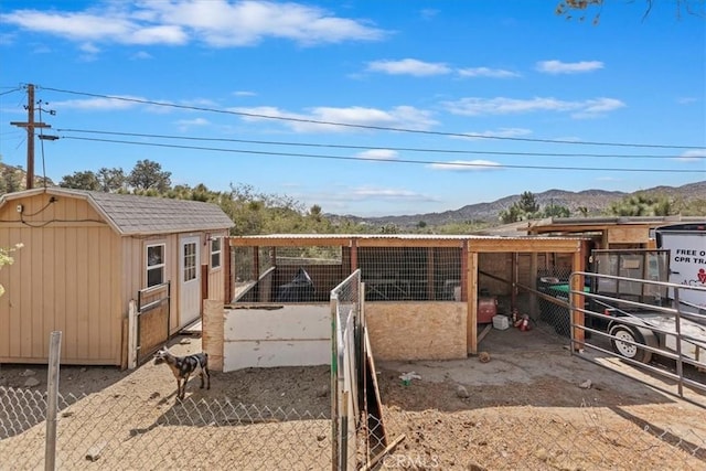 1946 Desert Front Rd, Wrightwood, CA 92397 - view of yard with a mountain view and a storage unit