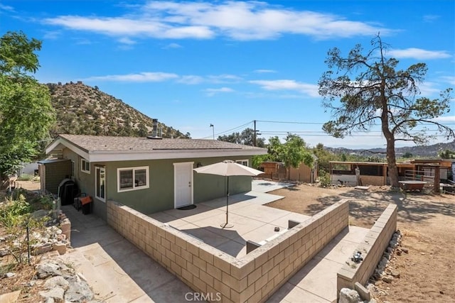 1946 Desert Front Rd, Wrightwood, CA 92397 - rear view of property featuring a patio area, a mountain view, and stucco siding
