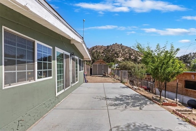 1946 Desert Front Rd, Wrightwood, CA 92397 - fenced backyard featuring a patio, a mountain view, and a storage shed