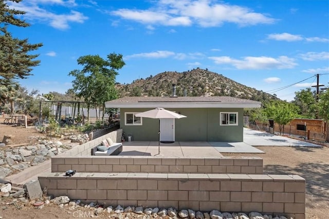 1946 Desert Front Rd, Wrightwood, CA 92397 - rear view of house featuring a mountain view and a patio area