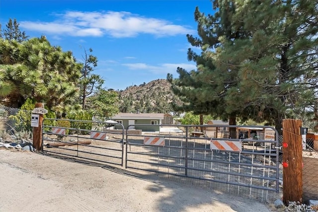 1946 Desert Front Rd, Wrightwood, CA 92397 - obstructed view of property with a gate and a mountain view